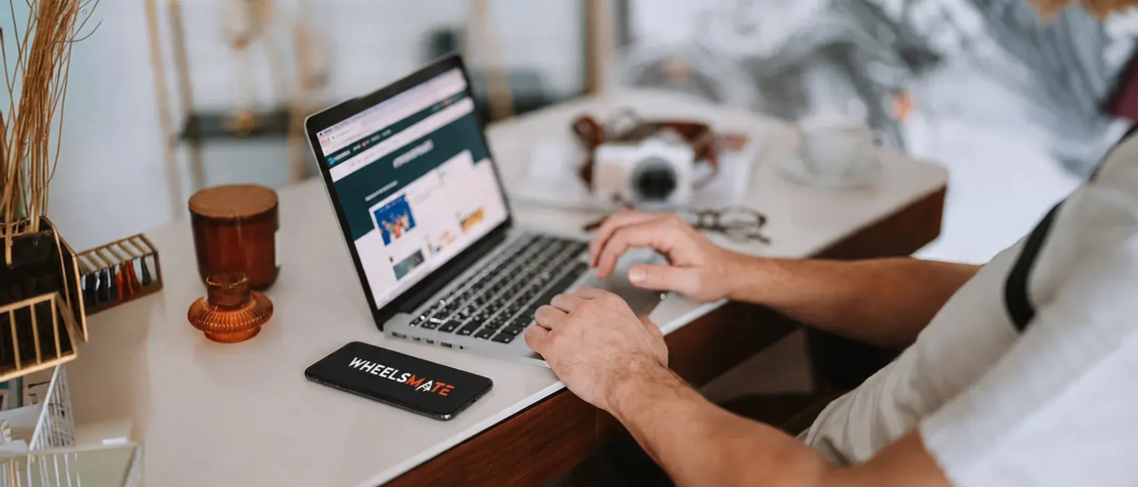 Person browsing Wheels Mate on a laptop